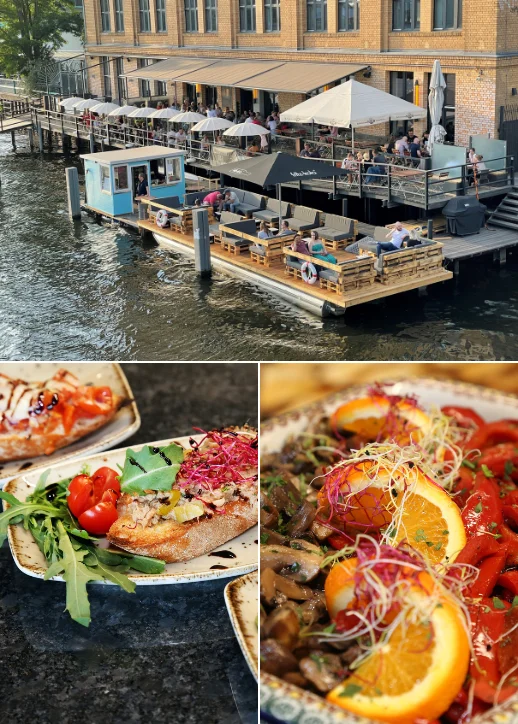 Ein Restaurant mit Blick auf das Wasser und einer frisch gebackenen Pizza auf dem Tisch.